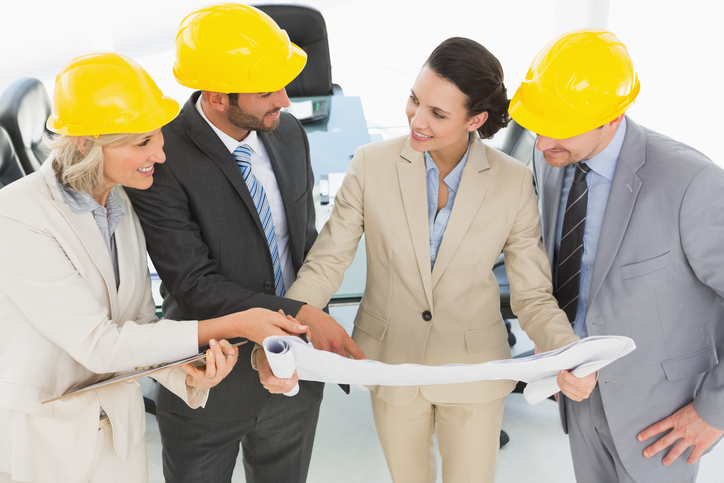 Engineer co-workers discussing a project