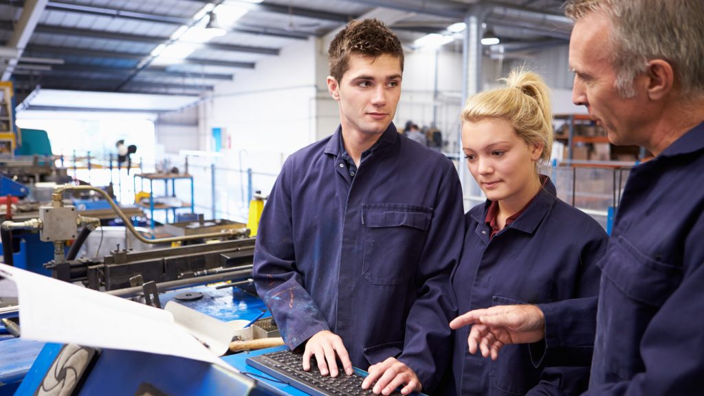 Engineer Teaching Apprentices To Use Tube Bending Machine