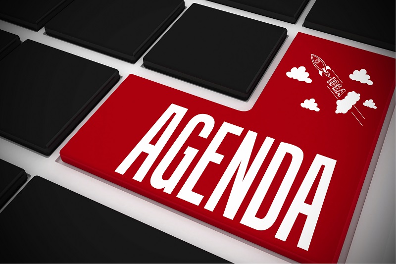 Agenda on black keyboard with red key