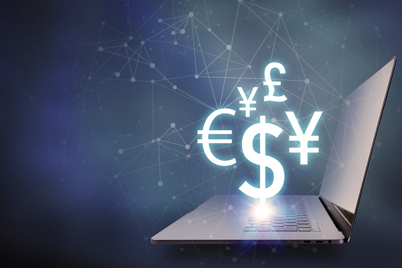 key currency symbols floating on laptop PC, financial technology concept