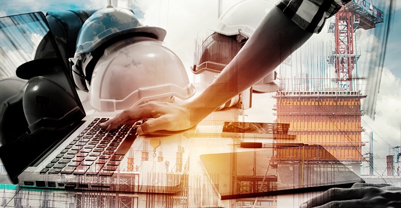 Double exposure architect working with laptop and blueprints in workplace for architectural plan,selective focus,Business concept
